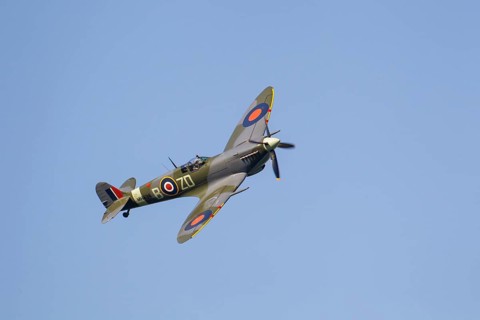 Supermarine Spitfire warbird military aircraft in Royal air force RAF colours flying, England,