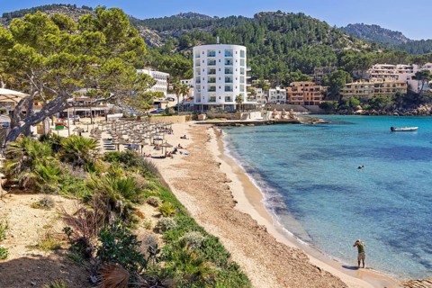 Scenics view at a coast village at the Mediterranean Sea with a sand beach and hotels by the sea at