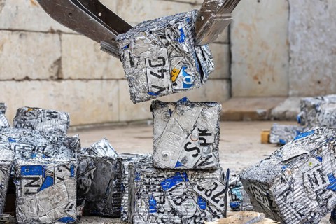 Cubes made from scrap metal, disused car licence plates. Symbolic photo. Stuttgart,