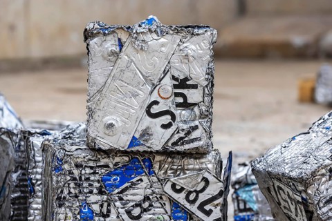 Cubes made from scrap metal, disused car licence plates. Symbolic photo. Stuttgart,
