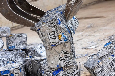 Cubes made from scrap metal, disused car licence plates. Symbolic photo. Stuttgart,