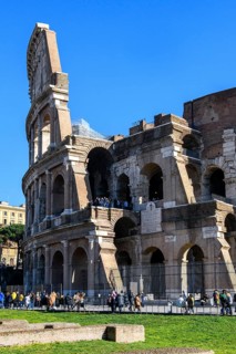 View of partially restored façade on the left Exterior façade with large arched windows Brick