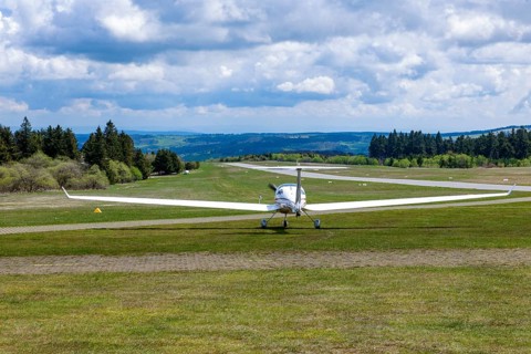 Motorised glider taxiing to the runway at Wasserkuppe airfield, Rhön, Gersfeld, Fulda district,
