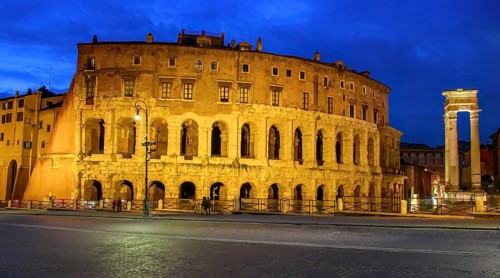 View at dusk blue hour on the left illuminated historical Marcellus Theatre Theatre of Marcellus on