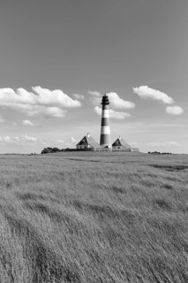 Lighthouse Westerheversand with two houses on a terp, Cumulus, monochrome, Westerhever, Eiderstedt,