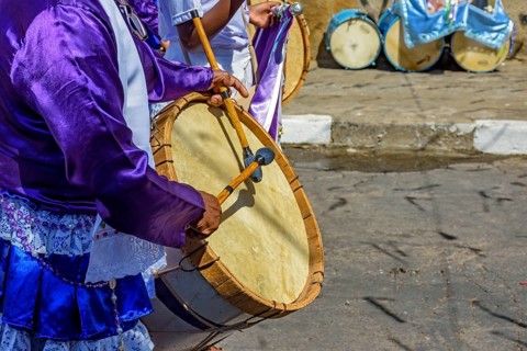 Congado parade with musicians and their drums and colorful clothes on the streets of Belo