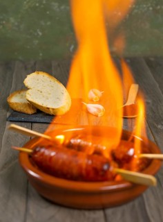 Spicy chorizo to hell cooked over a fire right on the table