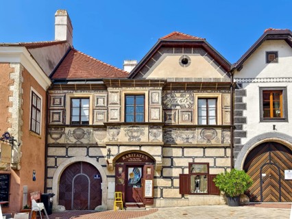 Renaissance building with frescoes and detailed stone decorations on a quiet street Mödling Lower