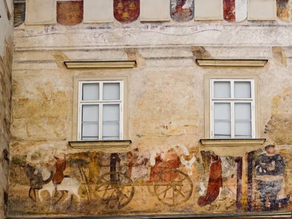 Faded medieval wall painting with windows and decorative elements Göglhaus Old Town Krems Wachau