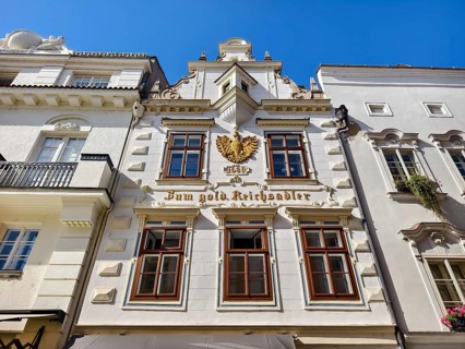 Decorative historic façade with eagle on a bright blue sky Old town Bürgerhaus Zum goldenen
