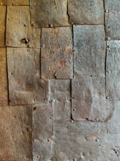 Textured rusty metal panels with rivets forming an industrial surface Riegersburgs Styria Austria