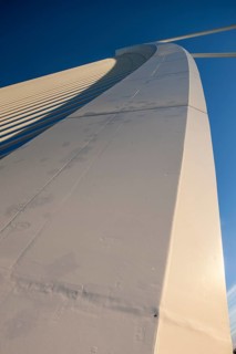 Detailed view of a structural component of a bridge under a blue sky