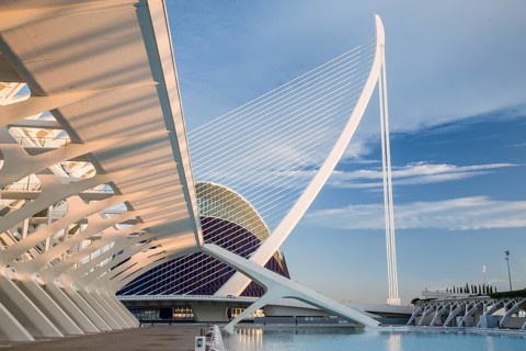 Modern architecture in Valencia with futuristic design and blue sky in the background City of Arts