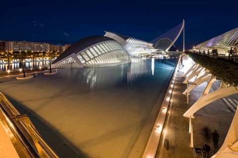 Valencia Spain Elegant modern buildings on the waterfront at night with reflections City of Arts