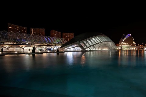 Valencia Spain Night view of the city with modern buildings and water in the foreground City of