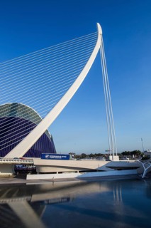 Futuristic bridge with an elegant design against a clear blue sky in Valencia