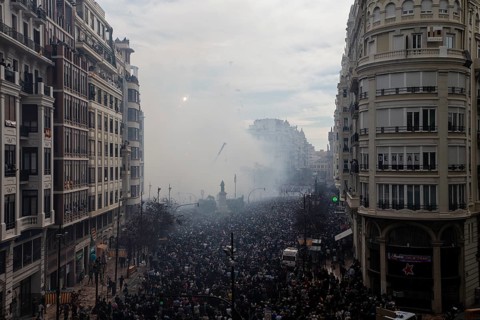Protesting crowds move through a smoky city centre MascletÃ¡ de Fallas