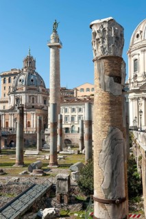 View of part of historic Trajan's Forum with ancient column fragments in front, behind it 40 metre