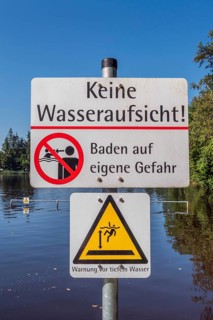 Warning sign, no water supervision, bathing at your own risk in the ArgenbÃ¼hl moor pool near
