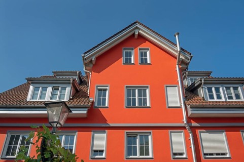 Red pointed gable facade with dormers, blue sky, Isny, Swabia, Baden-WÃ¼rttemberg, Germany