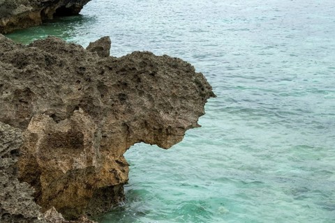 Sesoko's tail, rock formation, rugged cliffs of volcanic rock at the southern tip of Sesoko-jima,
