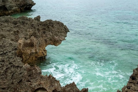 Sesoko's tail, rock formation, rugged cliffs of volcanic rock at the southern tip of Sesoko-jima,