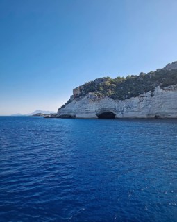 Vibrant seascape with the Pirate Cave in Kemer, Turkey. Beautiful Turkish mediterranean coastline