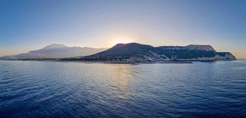Seaside panoramic view of Kiris resort near Kemer, Turkey, with sunset over the majestic Taurus