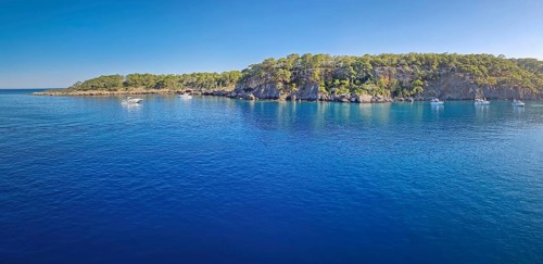 Wonderful Paradise bay of Camyuva, Kemer, Turkey. Scenery panoramic view of the coast with boats on