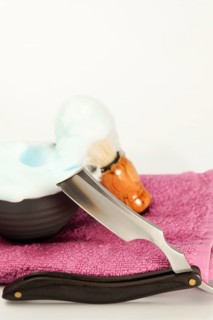 Shaving foam, brush and straight razor are ready for a perfect, classic shave