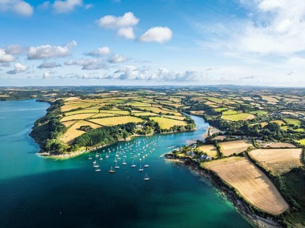 Farms and Fields over St Mawes from drone, Carrick Roads, River Fal, Falmouth, Cornwall, UK