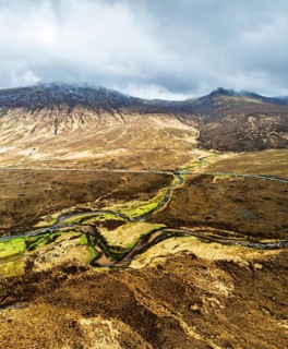 Panorama of Eas a' Bhradain Waterfall from drone, Red Cuillin mountains, Loch Ainort, Isle of Skye,