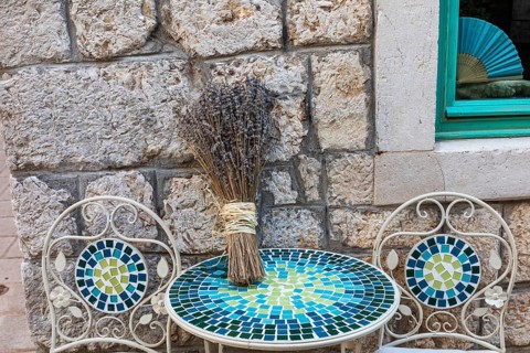 Lavender in bloom, alley in the old town centre, Starigrad, island of Hvar, Dalmatia, Croatia