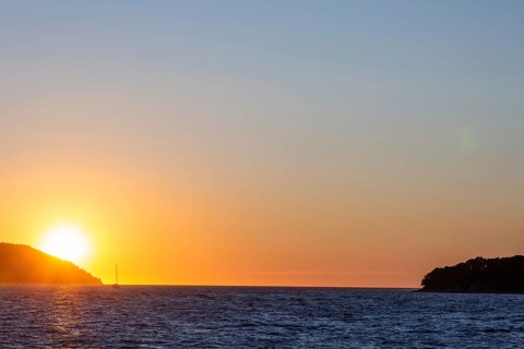 Sunset over the sea, sailing ship, near Starigrad, Dalmatia, Croatia