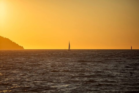 Sunset over the sea, sailing ship, near Starigrad, Dalmatia, Croatia