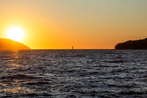 Sunset over the sea, sailing ship, near Starigrad, Dalmatia, Croatia