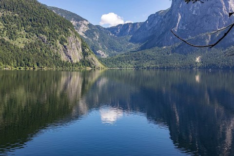 Lake Altaussee with mountains and wooded shores reflected in the water, Altaussee, Styria, Austria