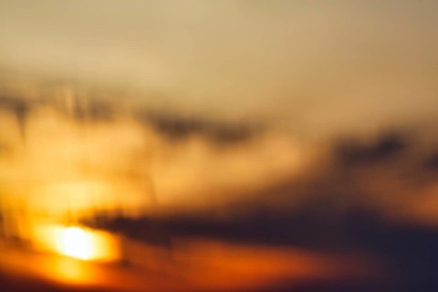 Sunset behind clouds, wipe effect, full-frame, Oia, Thira, Santorini, Cyclades, Greece
