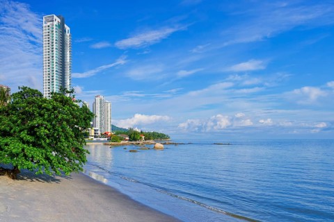 Penang skyline and beach on the Malacca Straits, Penang, Malaysia
