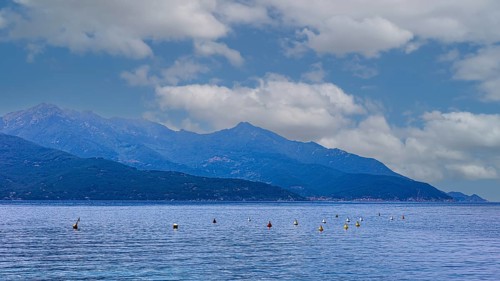 Clouds over the Golfo di Viticcio, in the background the mountains of Monte Capanne, Elba Island,