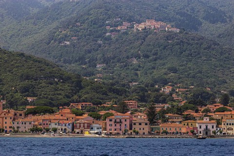 The harbour of Marziana Marina, behind the mountain village of Poggio, Elba Island, Tuscan