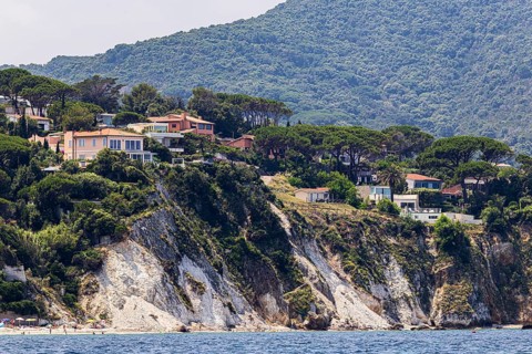 Holiday homes above rocky cliffs, Portoferraio, Elba Island, Tuscan Archipelago National Park,
