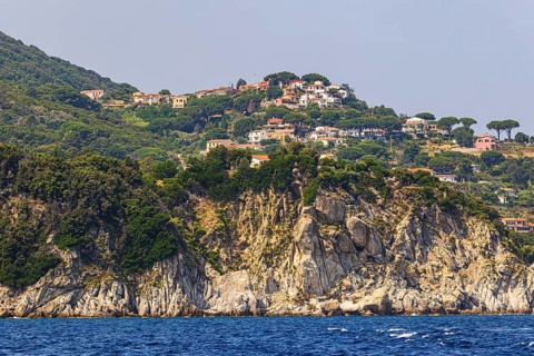 The village of Sant' Andrea above a rocky cliff, Elba Island, Tuscan Archipelago National Park,