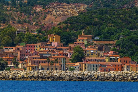 The village of Rio Marina with its pastel-coloured house facades, Elba Island, Tuscan Archipelago