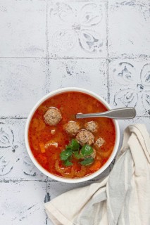 Romanian soup with meatballs, vegetable soup with meatballs, tiled table, homemade, no people