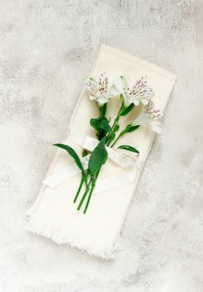 Kitchen towels, cream color, with alstroemeria, Peruvian lily, top view, concept, decor, no people