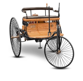 Replica of a old historic vehicle named patent motorcar isolated in white back with shadow
