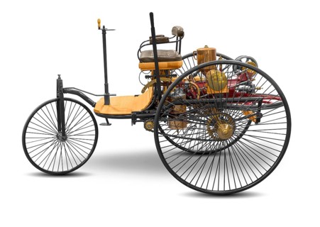 Replica of a old historic vehicle named patent motorcar isolated in white back with shadow