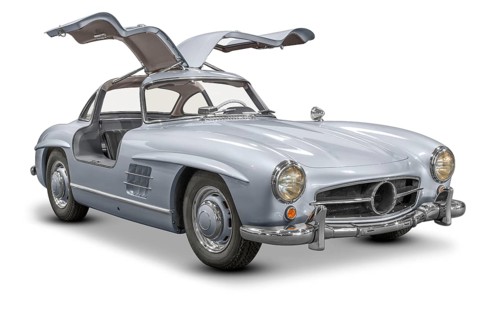 Historic car with opened wing doors isolated in white back with shadow