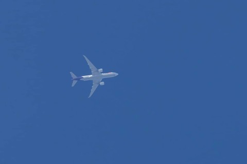 Airbus A300-600RF jet aircraft of FedEx Express airlines in flight in a blue sky, England, United